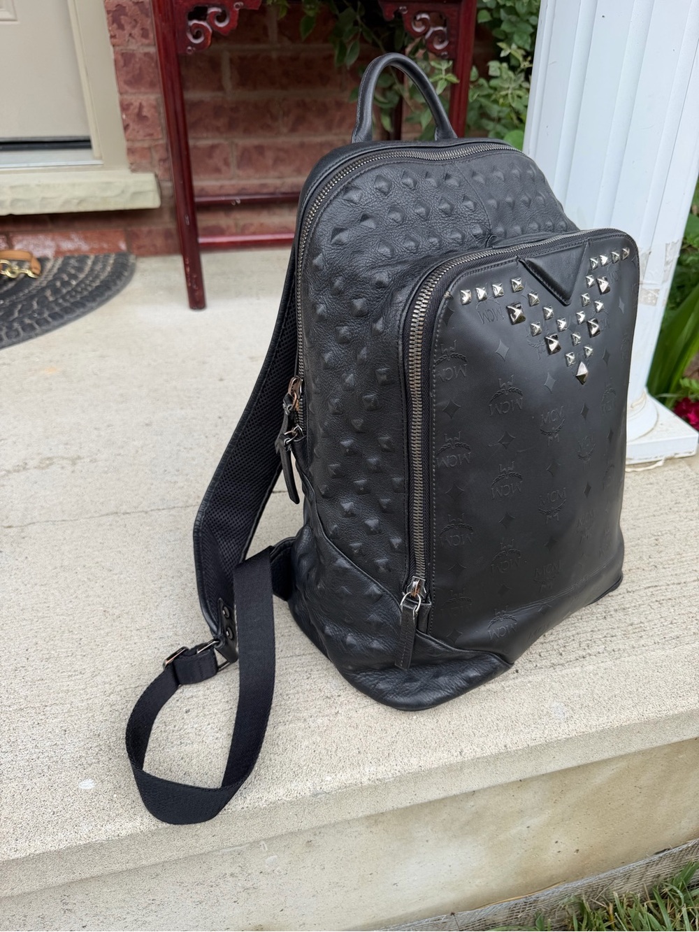MCM Black Embossed Leather Backpack with Stud Accents